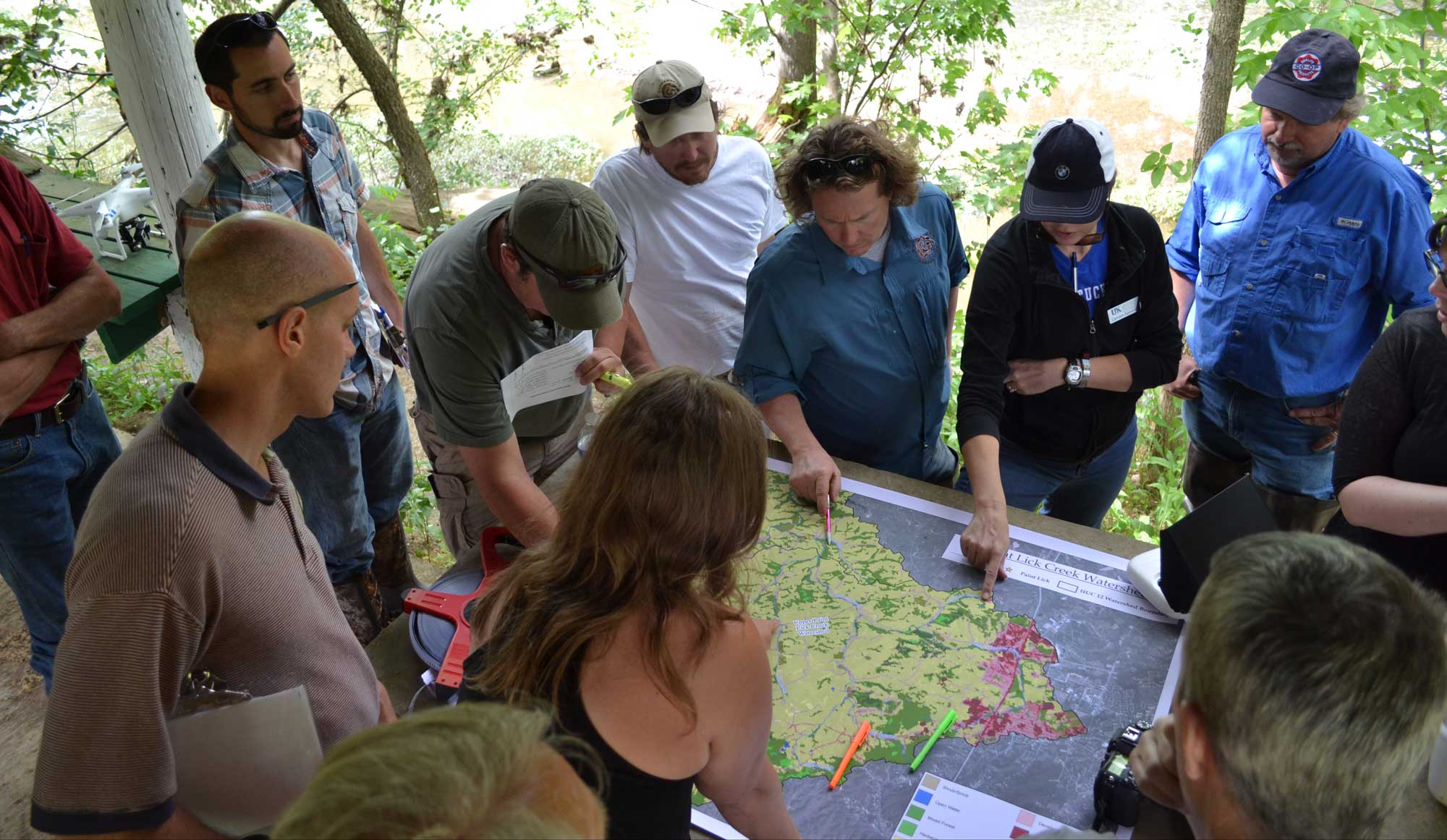 A group of people looking at a map