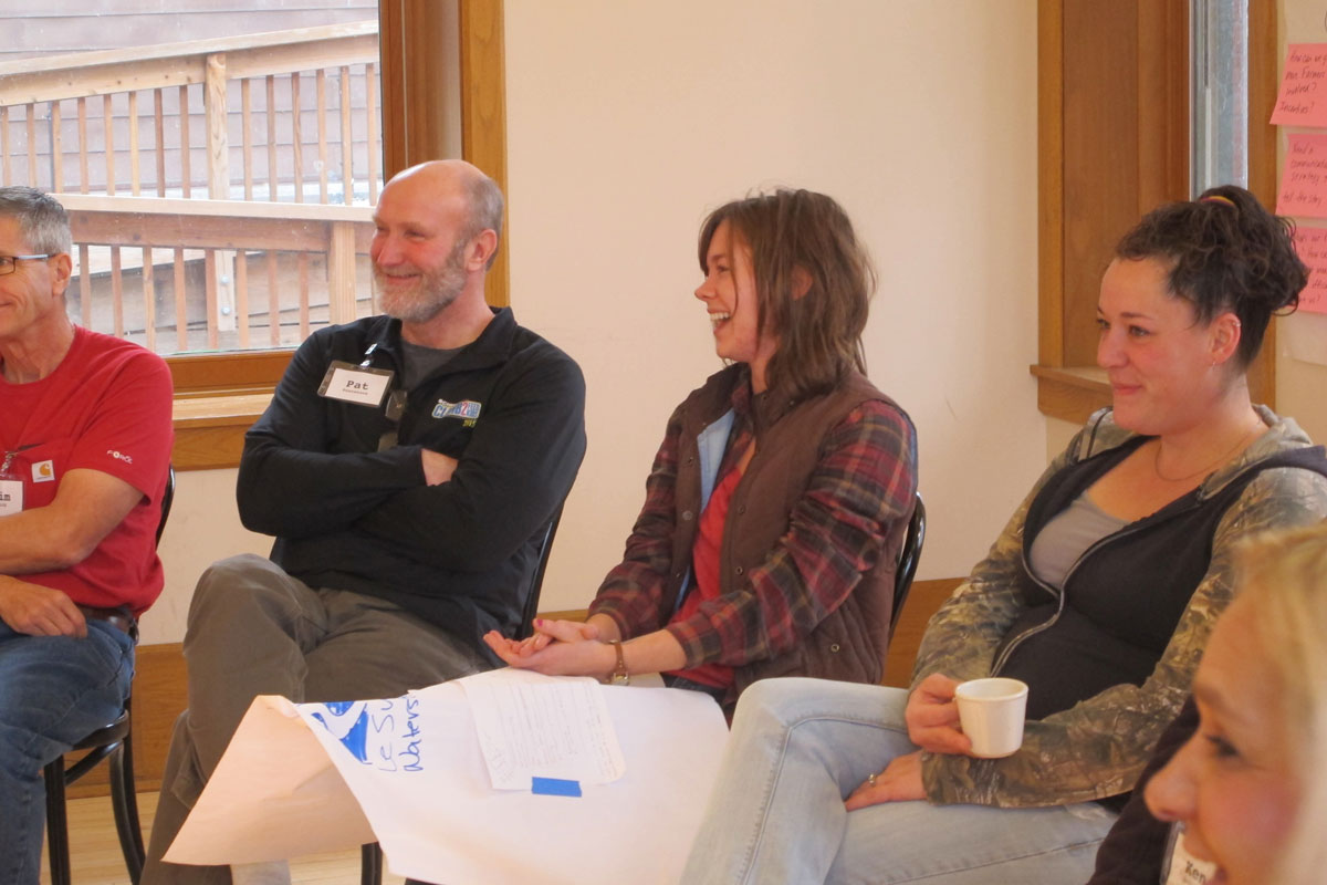 People sitting in chairs at a meeting